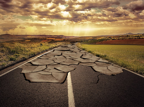 Asphalt road with cracks. Concept of problem and solution.