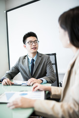 Successful young business executives meeting at the office