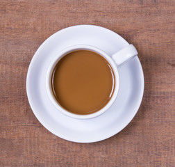 Cup of coffee on a wooden table.