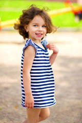 Cute little girl is playing in playground