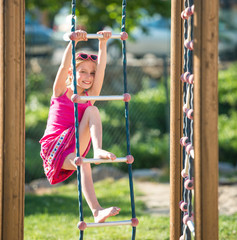 little girl on outdoor playground