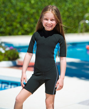 Happy Little Girl In A Wetsuit