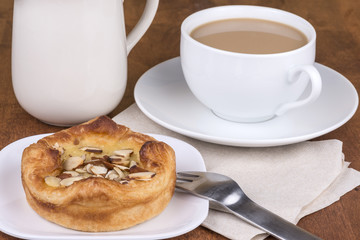 almond pastry and a cup of coffee