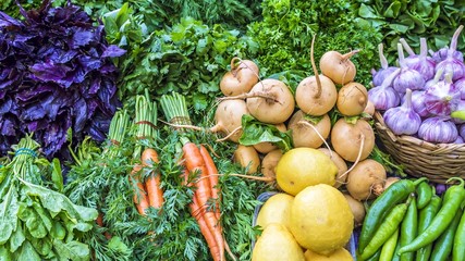 fresh vegetables and herbs on the counter market