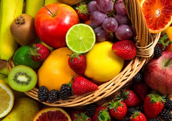 Möbelaufkleber Mix of fresh fruits on wicker bascket © larcobasso