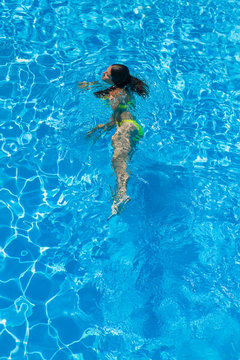 Young woman at the swimming pool