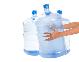 Naklejka premium Girl hands with a large mineral water container