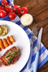 Grilled steak, grilled vegetables and fried potato pieces