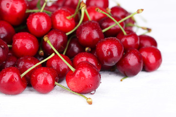 Obraz na płótnie Canvas Ripe sweet cherries on wooden table