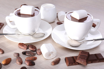 Cups of hot chocolate on table, close up
