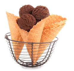 Tasty chocolate ice cream in waffle cone, isolated on white