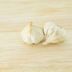 garlic and a whole wooden table closeup