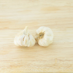 garlic and a whole wooden table closeup
