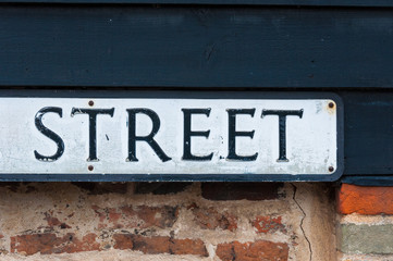 Sign for a street on a clading wall