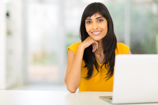 Indian Woman Sitting In Front Of Laptop