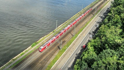 Red train at riverside