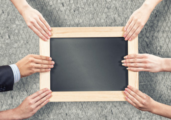 Hands holding frame
