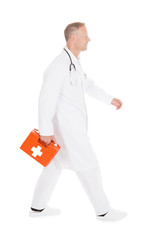 Doctor Walking With First Aid Kit Box