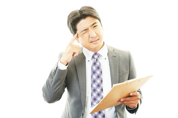 頭痛を訴えるビジネスマン