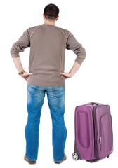 Fototapeta premium traveling young man with suitcas