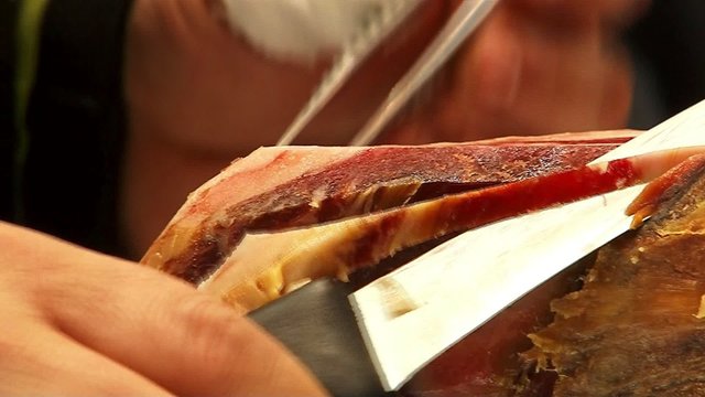 Slicing of jamon. Close up.