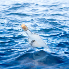 Bottle with a letter swims in the sea