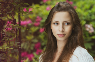 Naklejka premium beautiful girl with dark hair outdoor