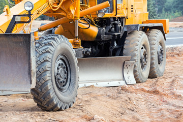 Closeup of road grader blade