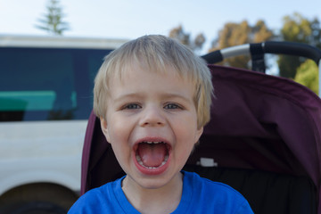Happy little boy with his mouth open