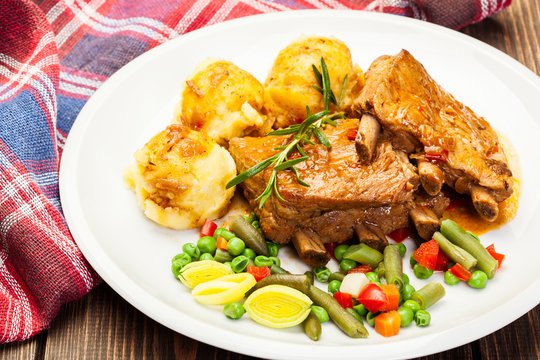 Pork spareribs served with mashed potatoes