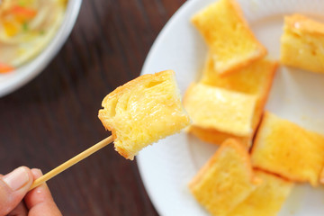 Toast with butter and sprinkling with sugar.