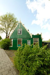 rural dutch scenery of small old houses and canal in Zaanse, Net