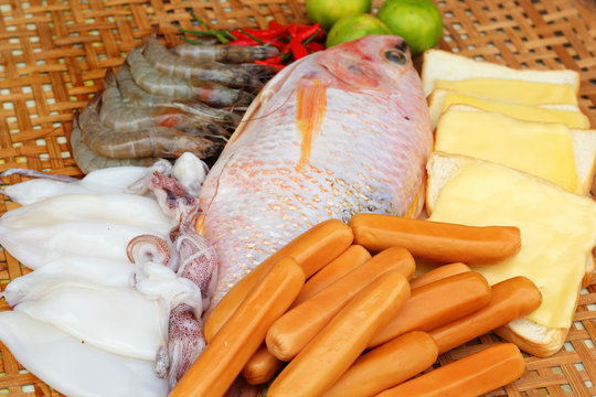 Fresh fish, squid, shrimp, streaky pork, sausages - for cooking.