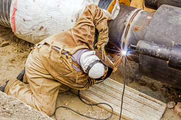 Metalworker working on a pipeline