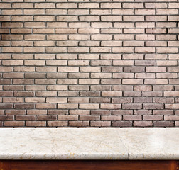 Empty marble table and brick wall in background. product display