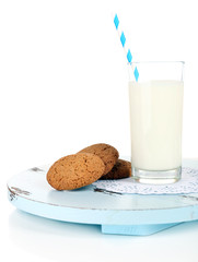 Milk and cookies on wooden tray isolated on white