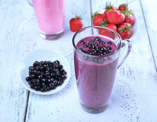 Delicious berry smoothie on table, close-up