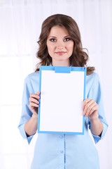 Young business woman in room