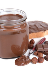 Sweet chocolate cream in jar isolated on white