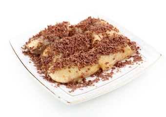 Sweetened fried banana on plate, isolated on white