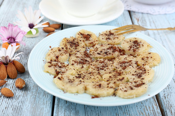 Sweetened fried banana on plate, close-up