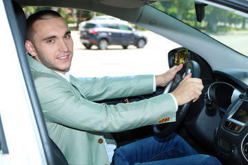 Man sitting in car