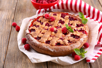 Tasty cake with berries on table close-up