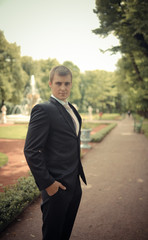 Portrait of the groom in park