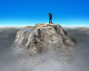 Man gazing on top of rocky money mountain
