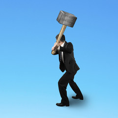 Businessman holding a sedge hammer © TSUNG-LIN WU