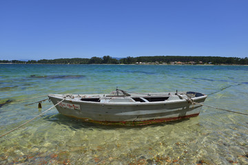 Naklejka na ściany i meble wooden colored boats in the beach sand
