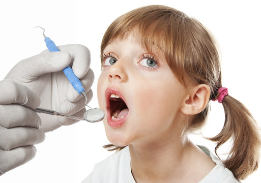 little girl at the dentist