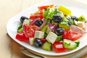 fresh vegetable salad with cheese and olives