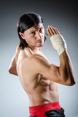 Ripped martial arts expert at training